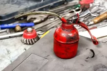 oil can on workbench with tools