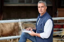 farmer working on his laptop
