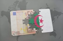 puzzle with the national flag of algeria and euro banknote on a world map background. 3D illustration