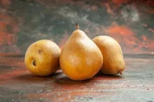front view sweet pears on a dark background fruit pulp apple photo