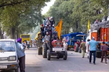 Anandpur Sahib, Punjab, India - March 2022: Portrait of sikh people (Nihang Sardar) travelling on tractor during the celebration of hola mohalla at anandpur sahib on holi festival.