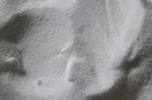 Background blur white urea pile.