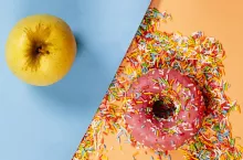 &lt;p&gt;Healthy food versus processed food concept. Strawberry donut and a fruit.&lt;/p&gt;