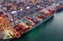 Aerial view container ship working at seaport, Global business company import export logistic and transportation of international global trading by container cargo freight shipping cargo vessel.