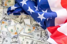 American flag and banknotes USD currency money