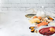 Balanced diet nutrition, healthy eating concept. Food sources rich in vitamin B12, cobalamin on a kitchen table