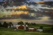 Sunset on a traditional dairy farm in rural Ohio in July