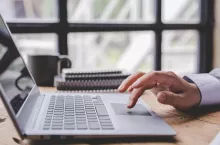 Typing on a tablet computer in a modern office. Make an account analysis report. real estate investment information financial and tax system concepts
