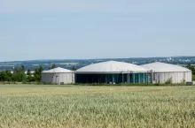 Biogas plant in Germany with grain field