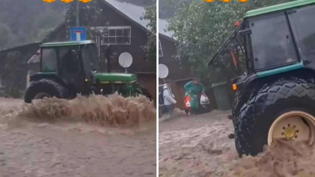 Rolnik własnym ciągnikiem ratuje kobietę, dziecko i psa z powodzi