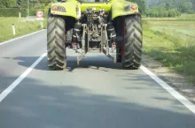 tractor on the country road, transportation and mobility in agriculture